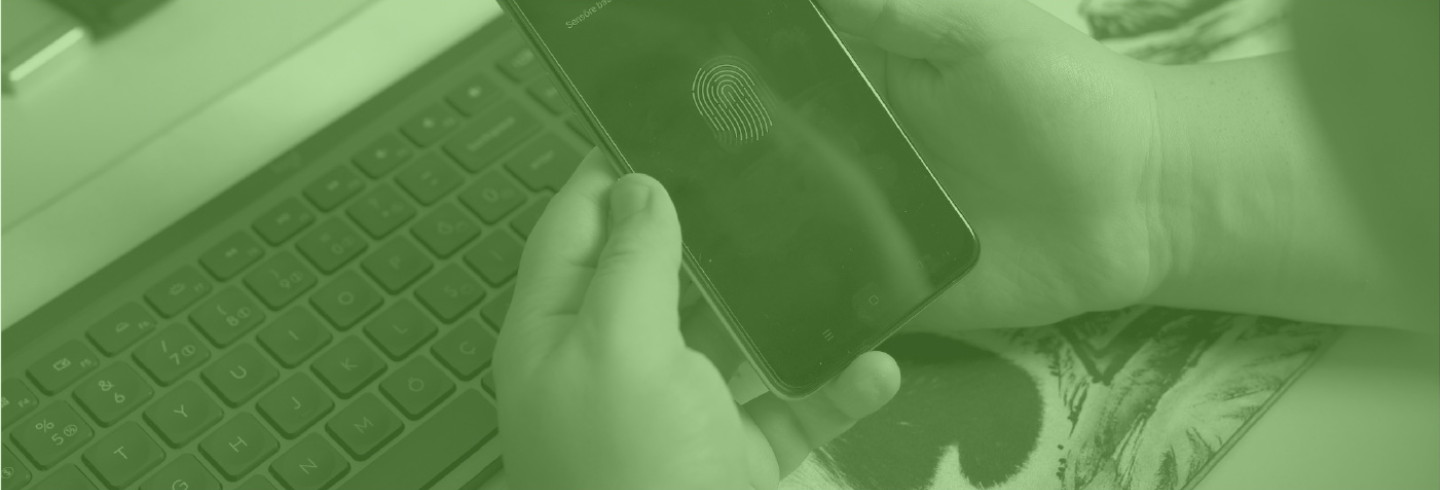 A person uses biometrics on a mobile device, overlaid with a color filter of Duo green